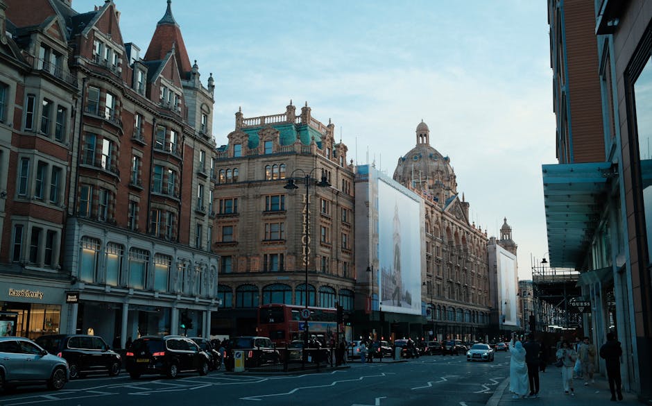 The image shows the ornate faÃ§ade of a historic building in Knightsbridge, near Harrods SW1X, decorated for the festive season with intricate golden and white holiday decorations. Large decorative st